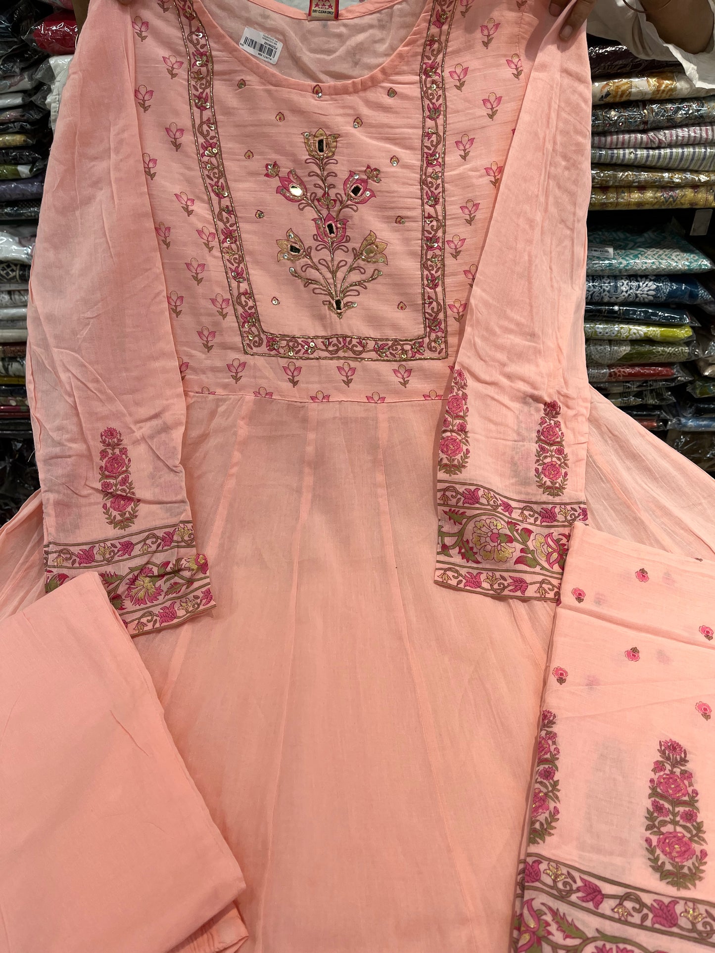 'ROYAL PEACHES' Premium mull cotton anarkali suit set with beautiful hand embroidery detailings on neckline and a premium cotton crotia lace work on all over its flare (along with pants and a block print mulmull dupatta with fourside latkans)